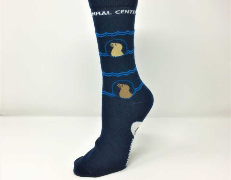 navy socks with sea lions and the words The Marine Mammal Center