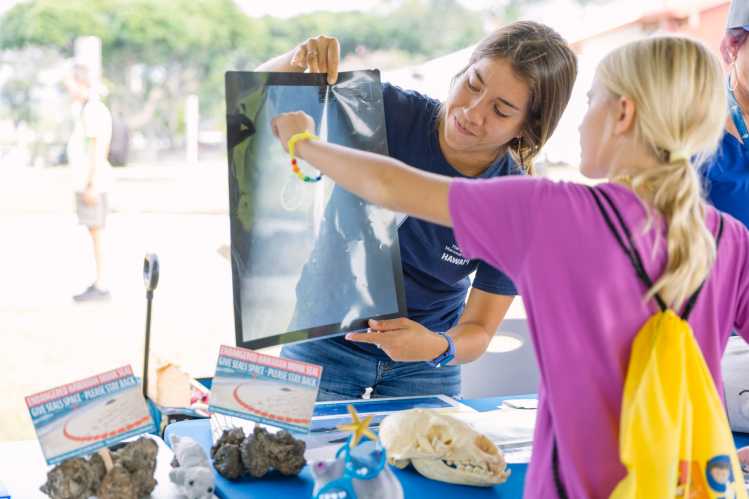 An educator showing a child an xray