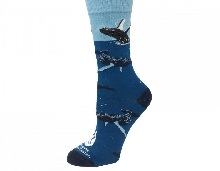 blue socks with humpback whales and the The Marine Mammal Center logo
