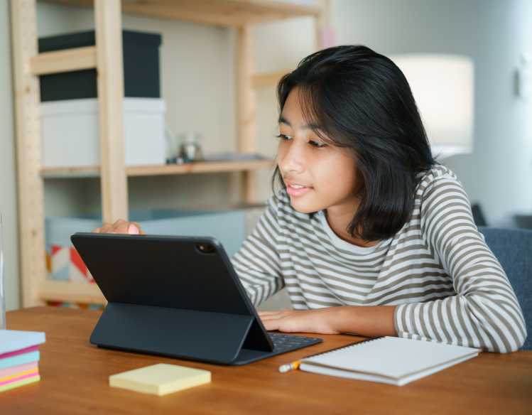 student interacting with a tablet