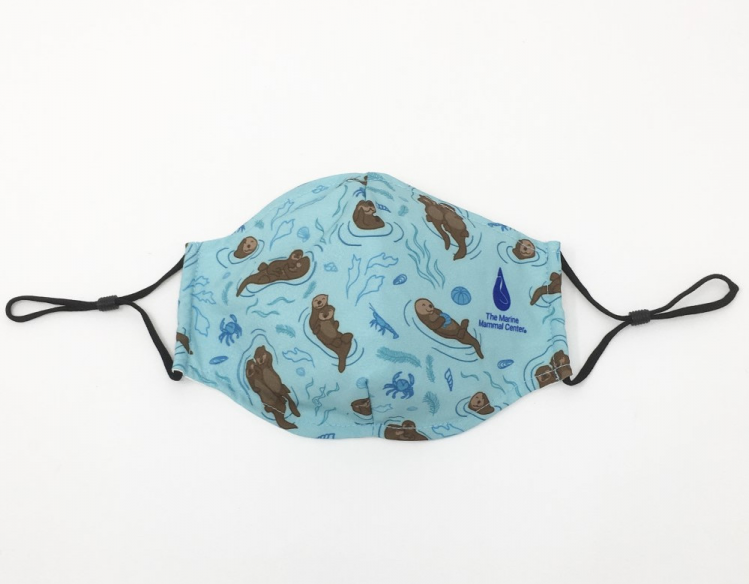 mask with sea otters and The Marine Mammal Center logo