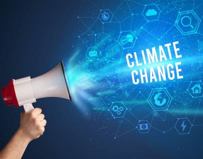 hand holding a megaphone with the words "climate change"
