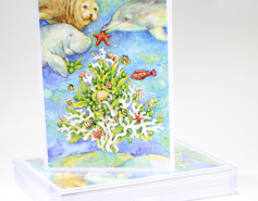 holiday cards with a Christmas tree made out of coral being decorated by marine animals