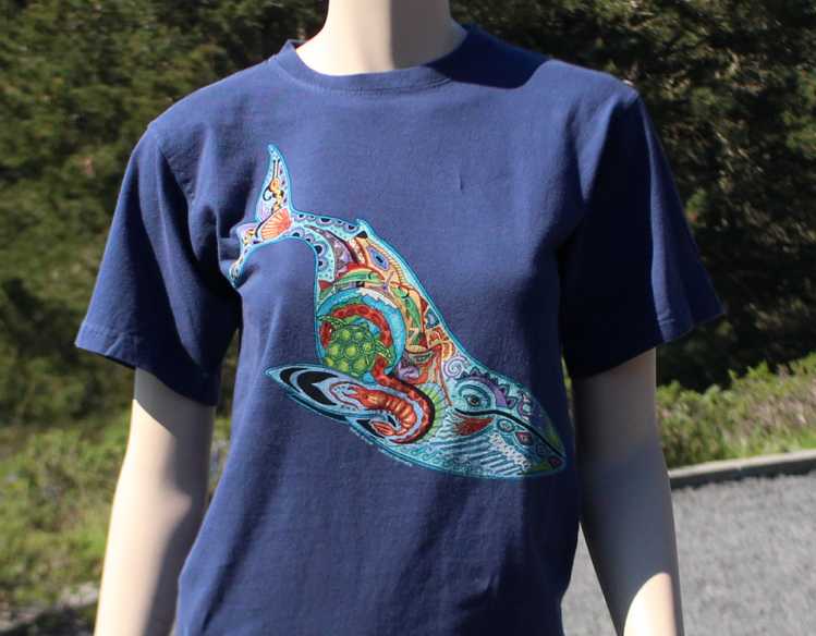 mannequin wearing navy T-shirt with whale art design