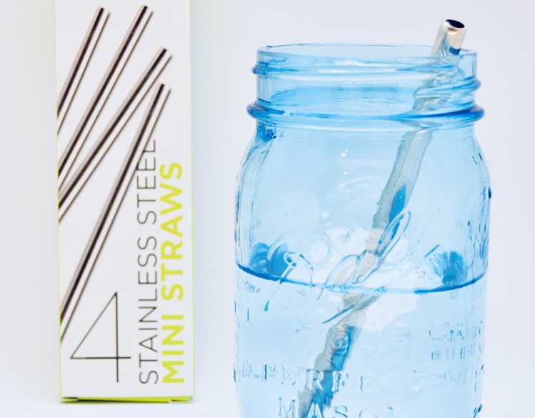 pack of mini straws next to a mason jar with a straw in it